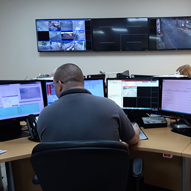 Security man monitoring CCTV images at GBSG control room
