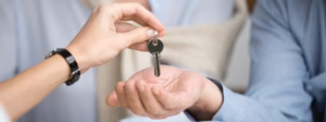 Keys being placed into another persons hands