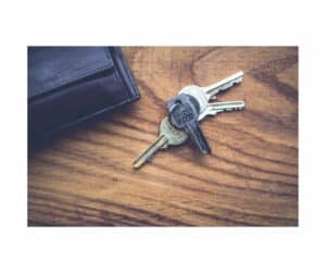 Lock up keys for keyholding service on a desk with a wallet