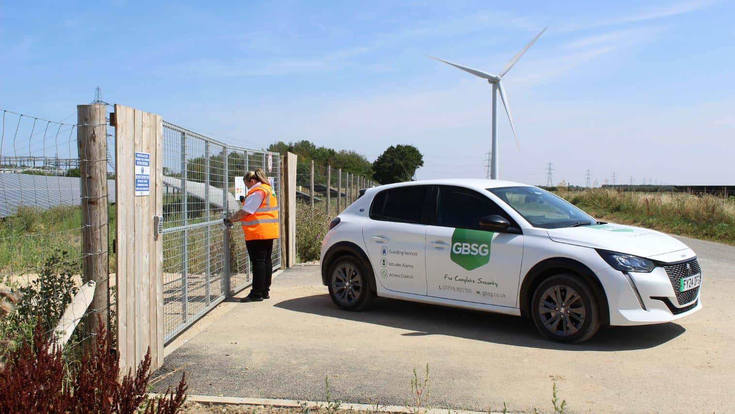 Security patrol guard locking solar farm gate